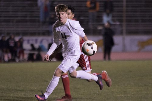 Lemoore's Eddie Rivadeneira keeps his eye on the ball in Tuesday's playoff loss to McLane High School in the opening round of the Central Section Playoffs.